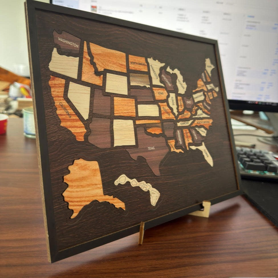 Wooden USA Map Puzzle Decor, Dimensions: With base: 11.81 x 0.28 x 9.69 in Without base: 11.73 x 0.28 x 9.69 in Weight: With base: 7.65 oz Without base: 7.05 oz
